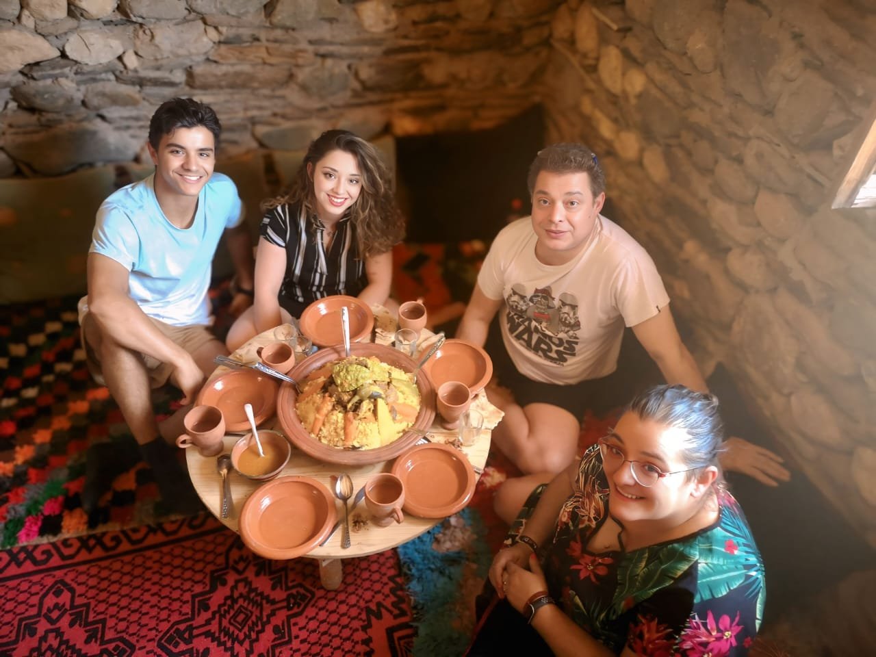 Guests exploring a kasbah and oasis valley